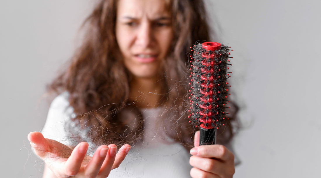 Depicting a woman holding a comb, troubled by hair loss possibly caused by biotin deficiency, resorting to Biotin Gummies